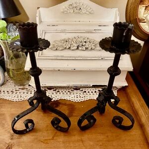Vintage wrought iron claw foot candlestick holders.
